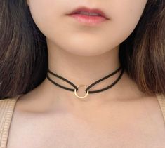 This trendy faux leather choker with Ring available in three different colors.   Two-layers of soft faux leather with Ring in middle.   This choker necklace is perfect for any outfit, whether punk, gothic, bohemian, etc.   The chokers are 12" in length with an extra 2" of chain for adjustability.    Available in Black, White or Brown. Trendy Adjustable Choker As Fashion Accessory, Trendy Adjustable Round Choker, Adjustable Round Trendy Choker, Necklace With Ring, Bohemian Choker Necklace, Beaded Necklace White, White Choker, Leather Choker Necklace, Boho Choker