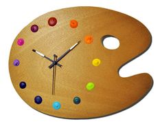 a clock made out of wood with colorful buttons on the face and numbers painted on it