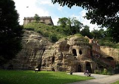 a large rock formation in the middle of a park