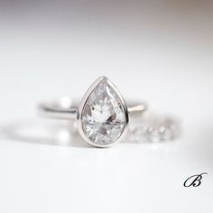 Brilliant cut center stones of same style: https://www.etsy.com/listing/228070549/40-cttw-bridal-set-ring-solitaire?ref=shop_home_active_42 Engagement ring only: https://www.etsy.com/listing/288894035/275-ctw-solitaire-ring-engagement-ring?ref=shop_home_active_16 All eternity band only: https://www.etsy.com/listing/220416565/15mm-wide-eternity-bnad-ring-wedding?ref=shop_home_active_55 Half eternity band only: https://www.etsy.com/listing/268701510/20mm-eternity-band-ring-brilliant-cut?ref=shop_h Anniversary Pear-shaped Rose Cut Diamond Ring, Pear-shaped Diamond Ring With Bezel Setting For Wedding, Classic Sterling Silver Pear-shaped Wedding Ring, Classic Teardrop Bezel Set Ring, Pear Shaped Bezel Setting Wedding Rings, Anniversary Rose Cut Diamond Pear Shaped Ring, Diamond Teardrop Ring With Bezel Setting, Pear-shaped Bezel Set Wedding Ring, Classic Pear-shaped Sterling Silver Wedding Ring