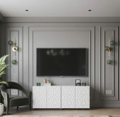 a large flat screen tv mounted to the side of a wall in a living room