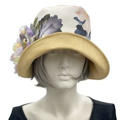 HANDMADE IN THE USAWear this lovely Eleanor cloche hat to a garden party, the horse races, or an afternoon wedding and you’ll appear just as chic as Mary on Downton Abbey in today’s 20s. Meticulously crafted with care, this wide brim linen hat - lined in soft cotton - offers effortless style without sacrificing comfort. Its full head coverage will protect you from the sun on a hot afternoon, and the pretty peony flower brooch adds a feminine touch. The flower is removable and can be worn elsewhe Cream Sun Hat For Spring Wedding, Chic Brimmed Cloche Hat For Spring, Chic Spring Brimmed Cloche Hat, Chic Cloche Hat For Spring Wedding, Fitted Short Brim Hat For Spring, Fitted Sun Hat For Spring Weddings, Spring Fitted Cream Boater Hat, Spring Wedding Cloche Hat With Short Brim, Spring Wedding Brimmed Cloche Hat