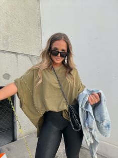 Details Cropped Hoodie with Button Detailing Color: Olive Material: Knit Size Runs True to Size Model is Wearing a Size Medium Model Measurements Size: 6/8 Height: 5'2" Weight: 150lbs Bust: 35" Waist: 28" Hips: 37" Bra Size: 34D Trendy Batwing Sleeve T-shirt For Fall, Spring Khaki Top For Streetwear, Khaki Tops For Spring Streetwear, Khaki Top For Spring Streetwear, Spring Streetwear Khaki Top, Oversized Short Sleeve Sweater For Fall, Oversized Short Sleeve Fall Sweater, Trendy Drop Shoulder T-shirt For Fall, Casual Drop Shoulder Tops For Fall