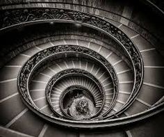 a spiral staircase is shown in black and white