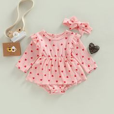 The sweetest little Polka Heart Outfit for your little love! The dress style romper is available in white and pink and comes with a matching headband to complete the darling look. Playful Pink Long Sleeve Bubble Romper, Playful Pink Heart Print Dress, Sweet Pink Bubble Romper For Playtime, Pink Long Sleeve Romper For First Birthday, Heart Outfit, Newborn Girl Dresses, Long Sleeve Jumpsuits, Muslin Dress, Fall Baby Clothes