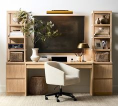 a desk with a chair, vases and bookshelves in front of it