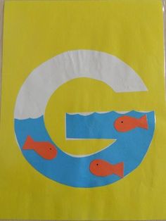 a paper bag with the letter g painted on it and fish in the water below