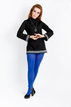 Hippie Shake! Our ethnic tunic is a 1960s-inspired long-sleeved longer shirt or very short A-line mini dress with trumpet sleeves made of Romanit jersey with a stand-up collar. The tunic is decorated with a beautiful border with a geometric pattern in an ethnic design in the colors pink, royal blue, green and black. We have incorporated a concealed zipper on the collar in the back to make it easier to put on and take off. An absolute key piece for your wardrobe, because the tunic can be combined Mod Long Sleeve Mini Dress For Spring, Bohemian Long Sleeve Stretch Mini Dress, Vintage Long Sleeve Mini Dress For Fall, Retro Long Sleeve Mini Dress For Fall, Fall Retro Long Sleeve Mini Dress, Traditional Long Sleeve Tunic For Fall, 1960s Inspired, Sweater Mini Dress, Trumpet Sleeves