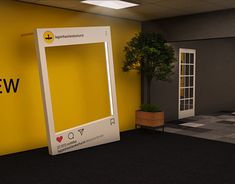 the entrance to an office building with a yellow wall and black carpeted flooring