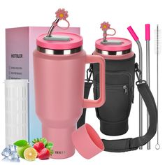 two pink coffee mugs with strawberries next to it and thermos in front