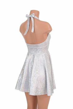 "This item is made to order, please read all the way through the listing before purchasing! This flowy dress is made of silver on white shattered glass holographic spandex. The halter top is darted and ties behind the neck, the hemline is circle cut. Length: 17\" measured from the waist to the hemline. We can create this dress from any other fabric in our shop, just ask! Womens Sizing (See below for instructions on where measurements should be taken) XXS: Bust 29\"-30\" / Waist 22\"-23\" / Hips Silver Backless Dresses For Party Season, Silver Backless Dress For Party Season, Silver Sleeveless Glitter Dress, Silver Fitted Backless Dress, Fitted Silver Glitter Dress, Silver Glitter Mini Dress For Summer, Silver Mini Dress For Summer Wedding, Elegant Silver Dress For Costume Party, Silver Glitter Holiday Dress