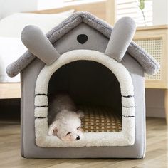 a dog is laying in his bed on the floor