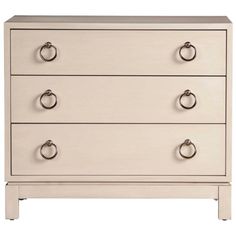 a white dresser with four drawers and three knobs