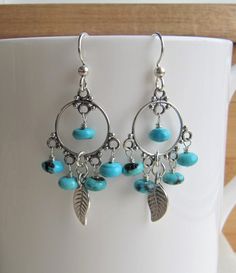 Turquoise and Silver Leaf Earrings, Chandelier Hoop Earrings, December Birthstone Gift, Handmade Earrings Silver, Blue Turquoise Earrings **ABOUT THESE EARRINGS** **SEE MEASUREMENTS BELOW** ❤️These super fabulous boho inspired earrings feature five hand wrapped blue Arizona Kingman Turquoise rondelles warpped to each sterling silver chandelier. I have added sterling silver leaves to the center of each earring and dropped all of these luscious elements from sterling silver ear wires. These beauti Turquoise Chandelier Dangle Earrings, Turquoise Dangle Hoop Earrings, Silver Leaf Earrings, Engraved Locket, Blue Sapphire Necklace, Mothers Bracelet, Earrings Chandelier, Silver Leaves, Silver Chain Bracelet