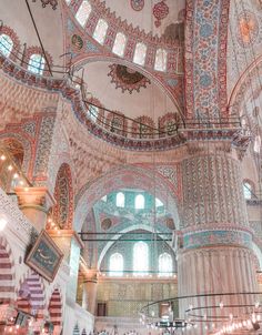 the interior of a large building with intricately decorated walls and ceilings, all in blue and white colors