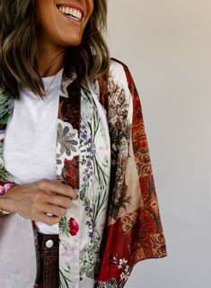 removable fabric belt long bell sleeves floral patchwork design side slits unlined no stretch 100% polyester hand wash cold Kat is 5’4” wearing size small small: 43" bust // 45.5" length medium: 45" bust // 46" length large: 47" bust // 46.5" length Spring Outerwear With Patchwork And Kimono Sleeves, Fall Boho Print Kimono, Fall Patchwork Kimono With Kimono Sleeves, Fall Patchwork Kimono, Bohemian Long Sleeve Floral Print Outerwear, One Size Multicolor Floral Print Outerwear, Bohemian Outerwear With Floral Print And Kimono Sleeves, Multicolor Floral Print One-size Outerwear, Multicolor Floral Print Outerwear One Size