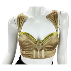 Tom Ford for Gucci Bustier Crop Top Italian size - 42 2004 Collection Composition: 85% Silk, 15% Spandex. Light Bronze Color Compliments with Yellow Velvet Accents. Decorative Matching Yellow Velvet Buttons, Bra with Underwire, Stretch Straps. Made in Italy. New without tag. Luxury Sleeveless Gucci Tops, Elegant Silk Gucci Tops, Gold Embroidered Silk Top, Luxury Yellow Silk Tops, Gucci Sleeveless Luxury Top, Luxury Beige Silk Top, Luxury Gucci Embroidered Logo Tops, Tom Ford Gucci, Gucci Runway