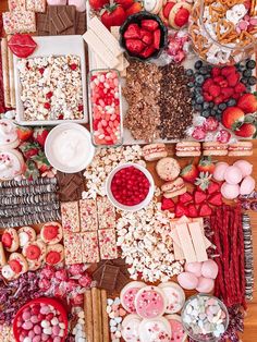 a table filled with lots of food and desserts