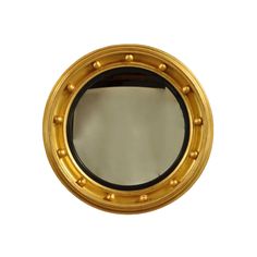 a mirror that is sitting on the wall in front of a white background with gold trim