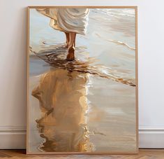 a painting of a woman walking in the water with her reflection on the wall behind it