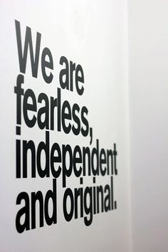 we are fearless, independent and original written on a white wall in an office building