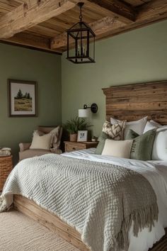 a bedroom with green walls and white bedding