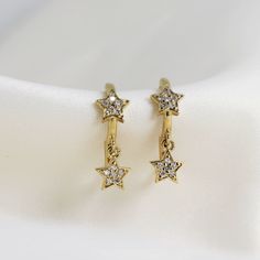 "Diamond Star Huggie Hoops, Dangling Star Hoop Earrings, 14k Gold Earrings, Gift For Her, Celestial Star Earrings Material; SOLD AS SINGLE OR PAIR ! 14k solid gold hoops and dangles earrings Hoops measure, inner diameter 9mm, outer diameter 12mm Star measure is 6mmx6mm Round Diamond: 24 pieces for pair Total carat weight 0.18 ctw for pair Diamonds are F color, SI clarity scale. Diamond is a stone that truly states, \"I love you\" in a deep way, it is symbol of deep, everlasting love. A diamond i Elegant Gold Hoop Earrings With Star Charm, Gold Celestial Earrings With Diamond Accents, Dainty Yellow Gold Star Charm Earrings, Dainty Yellow Gold Earrings With Star Charm, Elegant Gold Plated Star Earrings, Celestial Gold Earrings With Diamond Accents, Elegant Star-shaped Gold Plated Earrings, Dainty Yellow Gold Star Earrings, Elegant Gold-plated Star Earrings