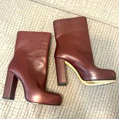 Theory “Obsidian” Exquisite Leather Boots. Color Is Called Cordovan And Is A Burgundy/Wine. There Is No Zipper - Pull On Style-Difficult If You Have High Arches. 4 1/4 Inch Heel Measured From Back With Hidden Platform. L. $655 At Theory. Size 38.5 Which Is 8.5 Excellent Condition Except The Bottoms Made In Italy Luxury Burgundy Leather Heels, Bold Leather Boots With Block Heel, Luxury Burgundy Leather Boots, Luxury Heeled Boots With Red Sole And Round Toe, Formal Boots With Red Sole And Square Toe, Bold Evening Boots With Round Toe, Bold Leather Boots With Round Toe, Burgundy Leather Platform Boots, Bold Leather Boots With Red Sole