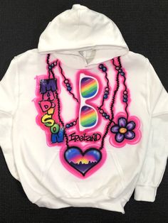 "This listing is for a White Airbrushed Hooded Sweatshirt with artwork on the front. 50/50 blend. *Sizes run small, It is recommended to size up. TO ORDER: Enter Name, Design Number and any Color Changes under \"Personalization\" Kids Sizes: X-Small (4/5) Small ( 6/8) Medium (10/12) Large (14/16) X-Large (18/20) Adult sizes also available. Sizes Small and Medium. *Heat Pressed to preserve artwork* DEFAULT DESIGN IS THE PRIMARY PHOTO ON THE LISTING. If you would like what is shown on the first ph Casual Hoodie With Custom Artwork For Streetwear, Casual Sweatshirt With Custom Artwork For Streetwear, Fun Graphic Print Hoodie Sweatshirt, Fun Graphic Print Hoodie For Streetwear, Fun Hooded Graphic Print Sweatshirt, Airbrush Ideas, New York Party, Design Number, Painted Clothes