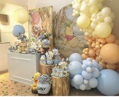 winnie the pooh birthday party with balloons and decorations