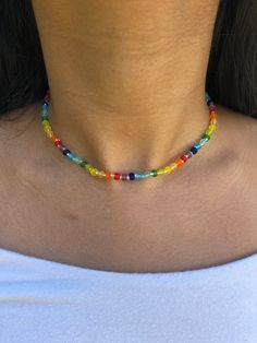 Adjustable beaded choker Necklace length can be adjusted from 12.5in-15.5in Choker is made from rainbow frosted glass seed beads (size 6/0) and clear seed beads (size 11/0) Necklace care: avoid wearing in water or to sleep to keep necklace in the best shape. Store in a cool, dry place. Overtime, the clasp and chain may begin tarnish. Cheap Trendy Rainbow Beaded Necklaces, Rainbow Necklace Beads, Adjustable Single Strand Crystal Choker Necklace, Adjustable Single Strand Crystal Choker, Adjustable Rainbow Beaded Choker Necklaces, Rainbow Adjustable Choker For Festivals, Rainbow Adjustable Choker For Festival, Adjustable Crystal Necklaces With Colorful Beads For Festivals, Adjustable Round Beads Faceted Choker