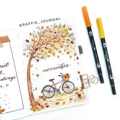 a notepad with a bicycle on it next to two markers and some pencils