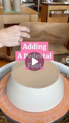 someone is adding a pedestal foot to a cake