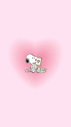 a dog sitting on top of a wooden floor next to a pink heart shaped wall