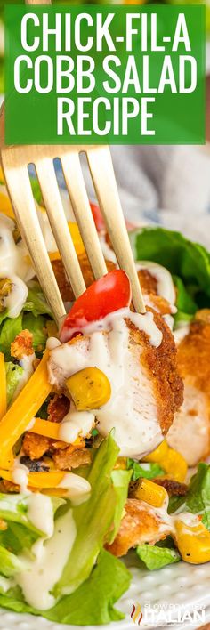 a chicken and vegetable salad with dressing on a white plate that has a wooden fork in it