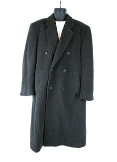 DESCRIPTION This is a great overcoat that was made by Gianfranco Ruffini.  The tag states that the fabric is a cashmere blend, and the fabric is from Italy.  The material is woven in shades of dark gray, and it has a soft texture.  The coat is fully lined, and it has a kick pleat in the back.  It closes with a row of buttons down the front, and there is a second row of ornamental buttons, giving it a double breasted look.  The coat also has two side pockets and two inside pockets.  SIZING The ta Mens Top Coat, Topcoat Men, Overcoat Men, Gray Cashmere, Mens Top, Wool Overcoat, Long Trench, Trench Jacket, Kick Pleat