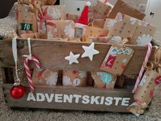 a wooden crate filled with lots of gift wrapped in brown paper