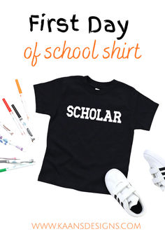 the first day of school shirt is on display next to some pens and pencils