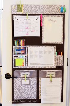 an organized bulletin board with pens, markers and paper clippings on the front door