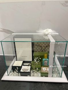 a display case filled with different types of jewelry and personal care items, including perfumes