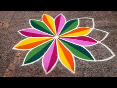 a colorful flower is painted on the ground