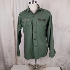 Very nice thick and soft cotton sateen US Army shirt....made in 1969...Vietnam eraOG 107. The shirt is in really nice condition. No holes or stains. No fraying. All buttons are there. Clean and ready to go.  Tag says 15 1/2 x 35....measurements: Armpit to armpit    22 inches Sleeve, from shoulder seam to end of cuff   25 inches Shoulder to shoulder   16 1/2 inches Length, from rear collar seam to end of shirt  28 inches Cotton Long Sleeve Camp Shirt With Button Closure, Military Cotton Tops For Streetwear, Military Style Cotton Tops For Streetwear, Relaxed Fit Military Cotton Top, Relaxed Fit Cotton Military Top, Military Cotton Shirt For Streetwear, Cotton Military Shirt For Streetwear, Cotton Camp Shirt With Pockets And Long Sleeves, Military Style Cotton Shirt For Streetwear