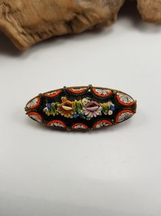 A beautiful multi coloured inlaid Micro Brooch made in Italy.. stunning the amount of work goes into these hand made pieces. All pieces are there and in good vintage condition.. Size of the Brooch is 1.5 inches and has a slightly domed looked which makes it stand out more . Intricate flower design in a plated gold setting. Vintage Multicolor Enamel Brooch Pin, Vintage Multicolor Collectible Brooches, Victorian Style Multicolor Brooches As Gift, Unique Multicolor Collectible Brooches, Vintage Multicolor Enamel Pin, Antique Handmade Oval Brooches, Antique Oval Handmade Brooches, Antique Enamel Handmade Brooches, Handmade Victorian Oval Brooches