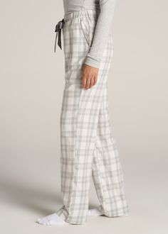 About Our Women’s Tall Flannel Pajamas You’ll never want to get out of bed when you’re wearing these women’s tall pajama pants. For years, tall women have had to settle for PJs that are way too short and fit in all the wrong places, but not anymore. You loved our classic flannel PJs and now we’re bringing you a pair with a regular fit and an open-bottom leg with all the length you need. These pajama pants have been designed exclusively for women between 5’9” and 6’6” with two different length op Plad Pajamas, Cute Pjs Pants, Women’s Pjs, College Pajamas, Pj Pants Outfit School, Flannel Pants Outfit, Pajama Pants Outfit For School, Pjama Pants, Cute Pj Pants