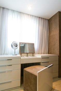 a white desk with a mirror on top of it