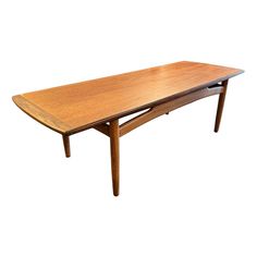 a wooden table sitting on top of a white background