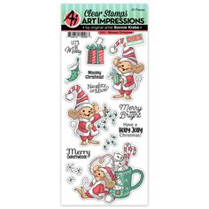 clear stamps featuring christmas characters and santa clauss, with the words merry on it