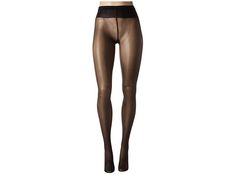 Wolford Neon 40 Tights - Hose : Black : Please note that the number in the style name indicates denier or density of the nylon. These silky, shiny Wolford tights are sure to add a little instant glam to any outfit! The comfortable tights flaunt a glossy, semi transparent design and a soft sewn-in elastic waistband. Camouflaging effect for legs, making them look smooth and flawless. Barely visible shadow toe reinforcement. Cotton gusset. 85% nylon, 15% elastane. Machine wash cold, line dry. Impor Sleek Solid Tights For Night Out, Sleek Solid Color Tights For Night Out, Sleek Stretch Stockings, Sleek Tights For Night Out, Sheer Stretch Stockings For Night Out, Sleek Tight Sheer Legwear, Sleek Sheer Fitted Tights, Sleek Tight Hosiery For Night Out, Sheer Fitted Sleek Tights