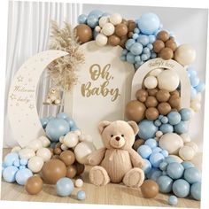 a teddy bear sitting in front of balloons and a sign that says oh baby on it