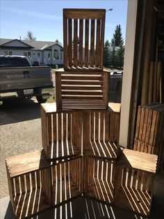 several wooden chairs stacked on top of each other